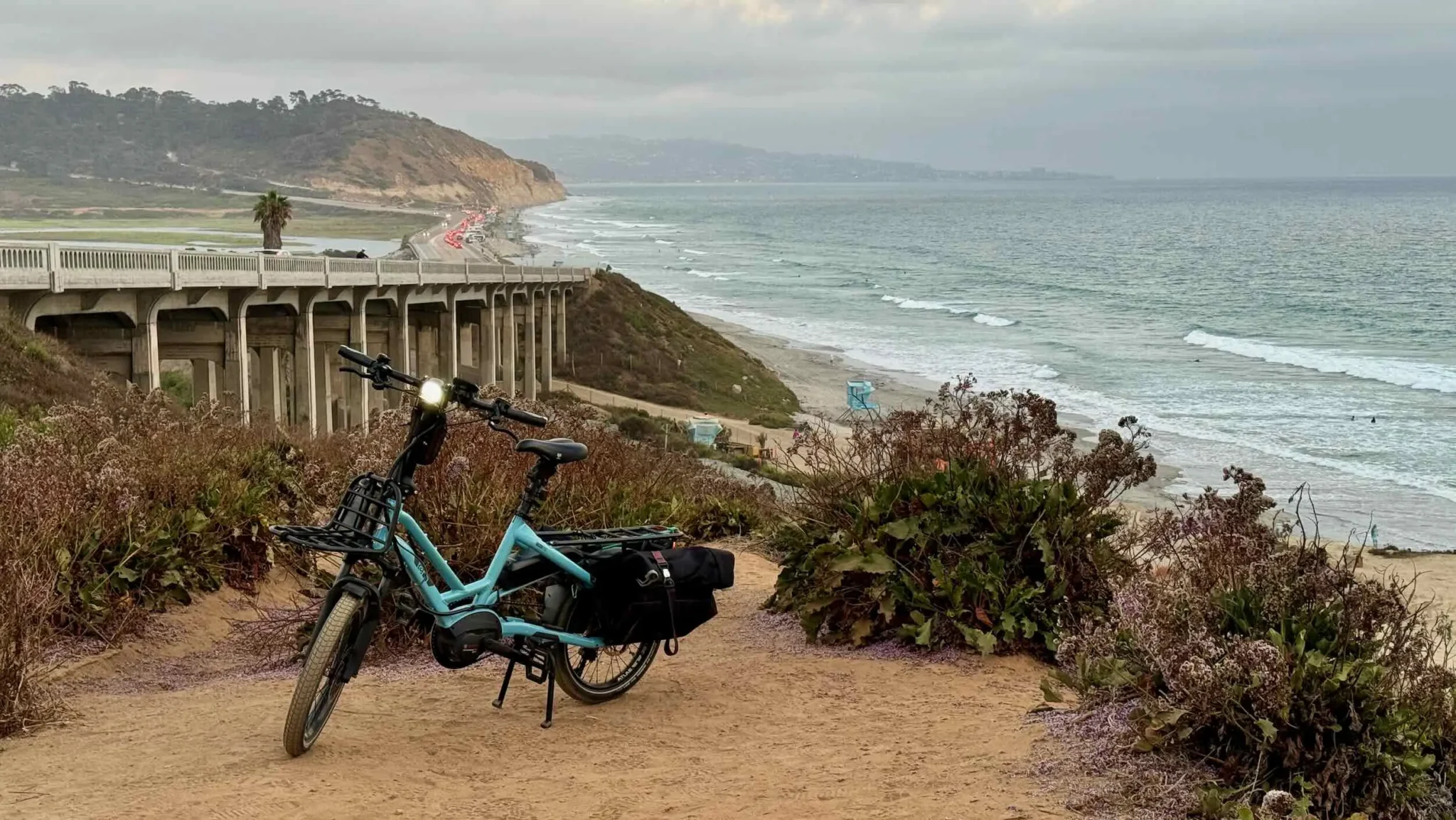 A Tern HSD e-bike sits on the bluffs above the ocean near Torrey Pines State Park in California